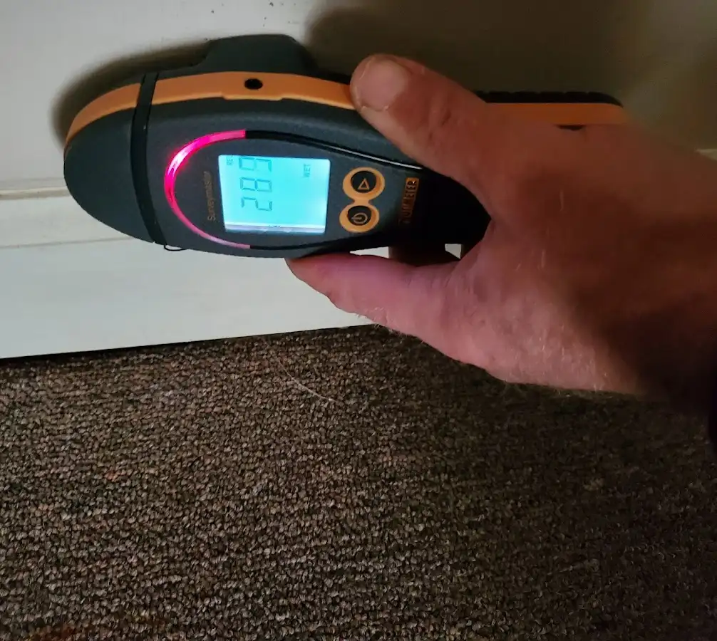 Moisture detection at baseboard during Storm Damage Restoration in Mishawaka